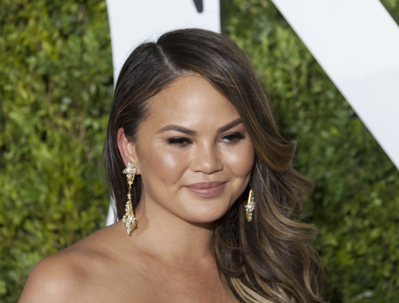 Chrissy Teigen Reacts To Instagram Slams In Glow Up Glam Mini Skirt And Bra!