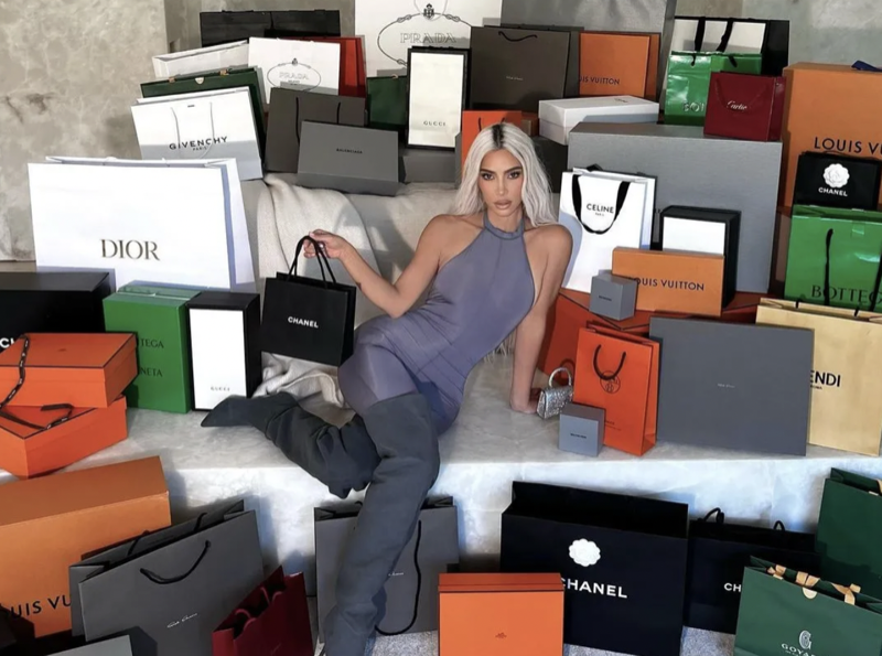 Kim Kardashian Fans Slam Her For Posing With A Mountain Of Designer Bags