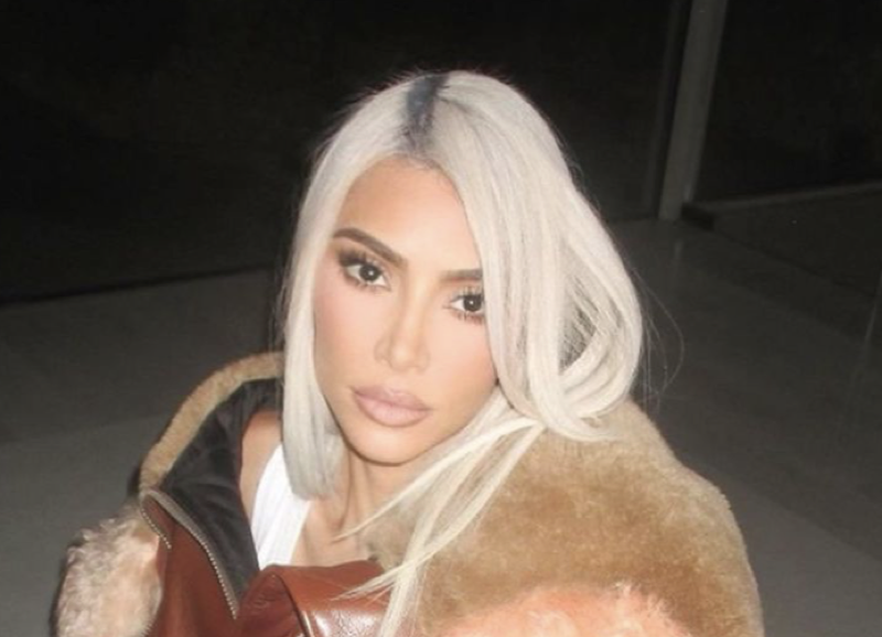 Kardashian fans slam Kim as 'tasteless' for posing with a mountain of designer  bags after outrage for 'flaunting wealth