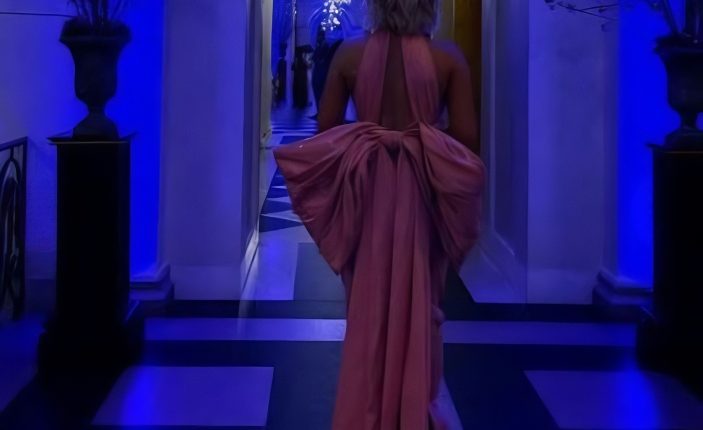 Wearing the pink dress in an official-looking building – @savanahchrisley – Instagram